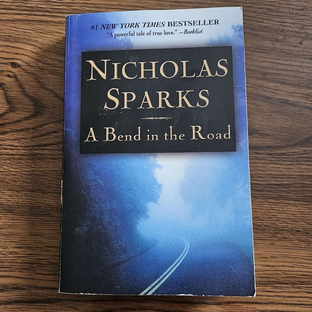 Blue Paperback Book Cover - A Bend in the Road